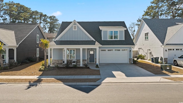 craftsman house featuring a porch and a garage