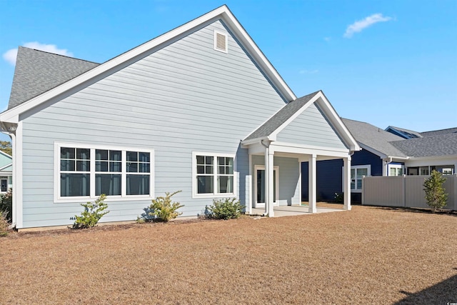 rear view of property featuring a patio area