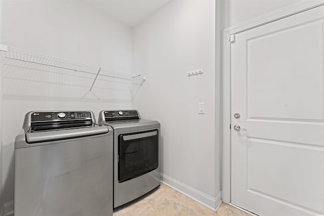 clothes washing area featuring washing machine and clothes dryer