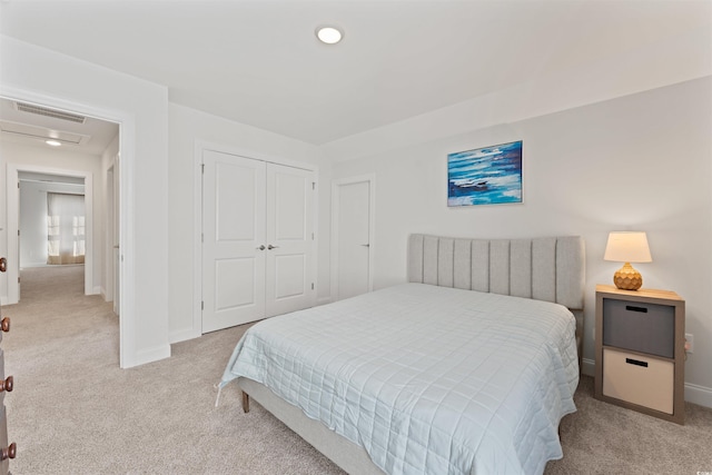 carpeted bedroom featuring a closet