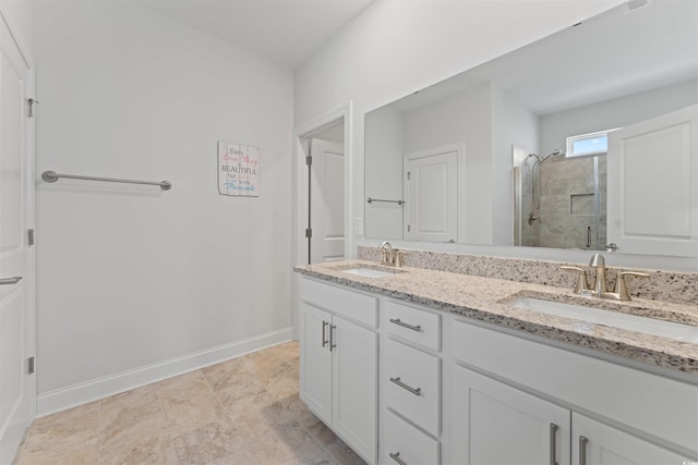 bathroom featuring vanity and an enclosed shower