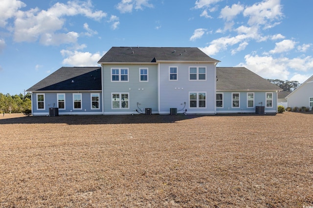 back of property featuring central AC