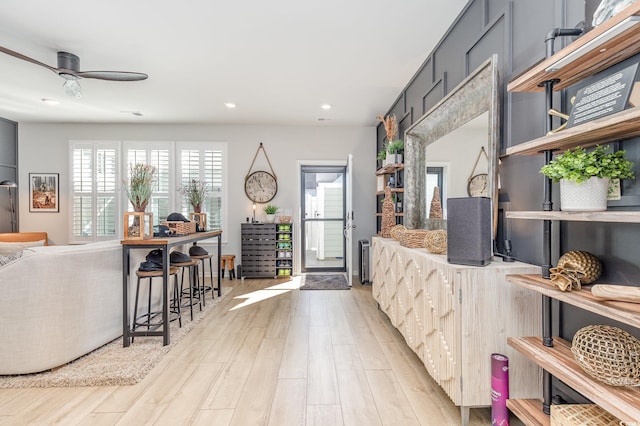 interior space featuring light hardwood / wood-style floors and ceiling fan