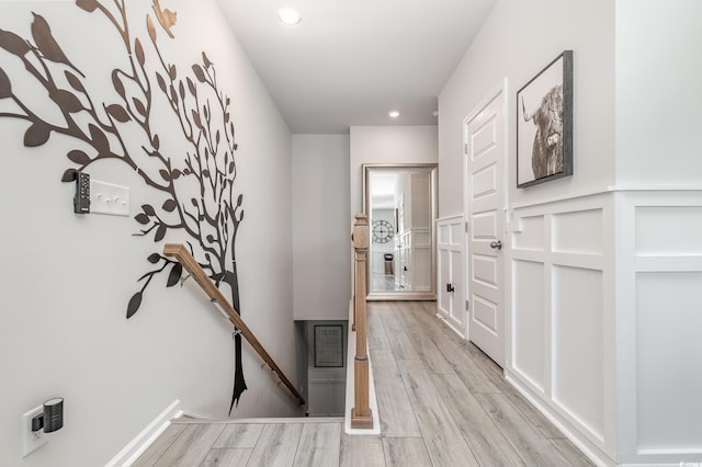 hall with light hardwood / wood-style flooring