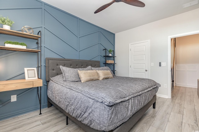 bedroom featuring light wood-type flooring and ceiling fan