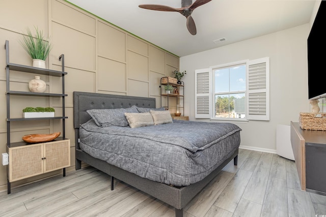 bedroom featuring light hardwood / wood-style flooring and ceiling fan