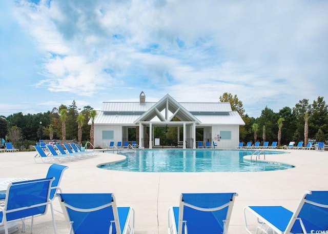 view of swimming pool with a patio