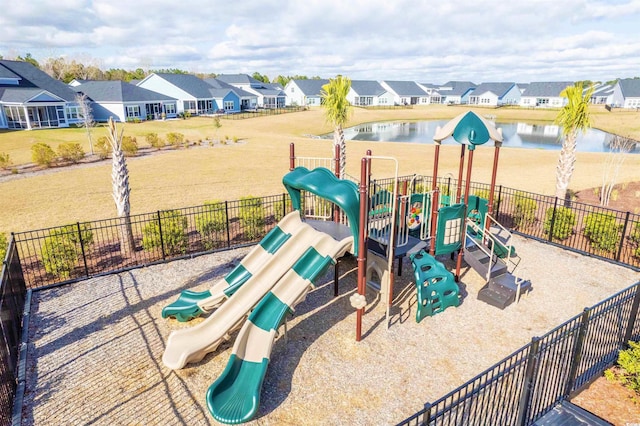 view of jungle gym featuring a water view