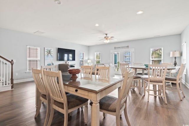 dining area featuring ceiling fan and dark hardwood / wood-style flooring