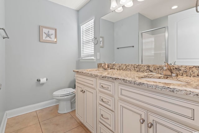 bathroom with toilet, tile patterned flooring, walk in shower, and vanity