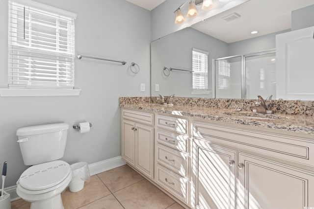 bathroom with toilet, a shower with door, vanity, and tile patterned flooring