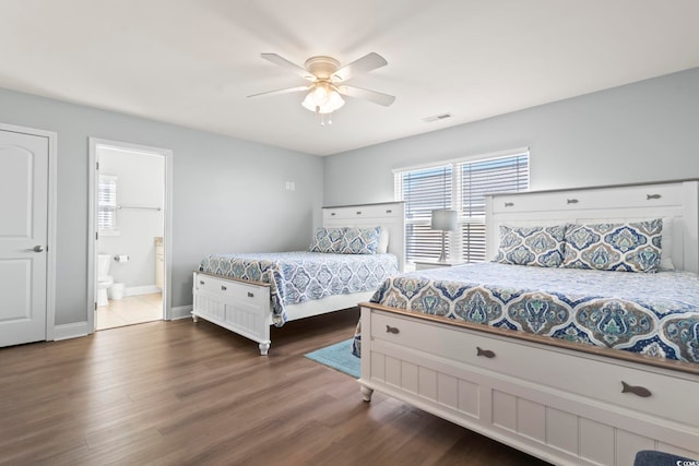 bedroom with ensuite bathroom, dark hardwood / wood-style floors, and ceiling fan