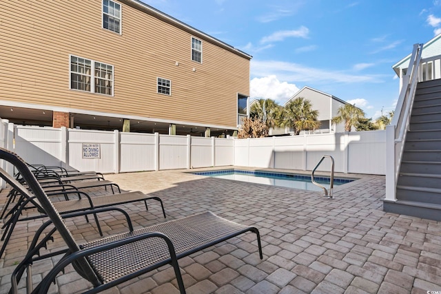 view of swimming pool featuring a patio