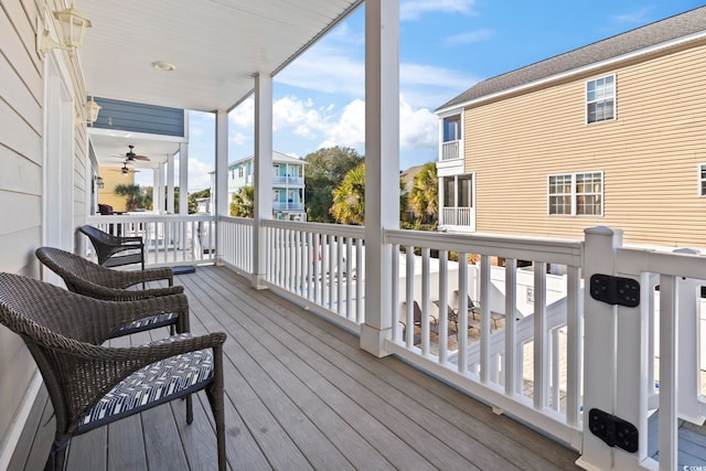 wooden terrace featuring ceiling fan