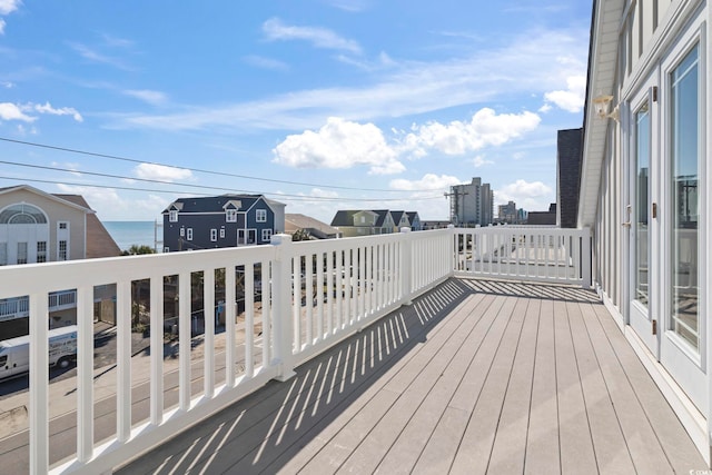 wooden deck featuring a water view