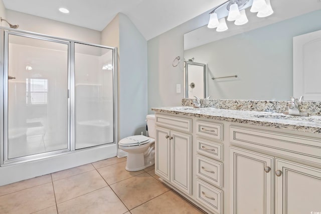 bathroom featuring walk in shower, toilet, tile patterned floors, and vanity