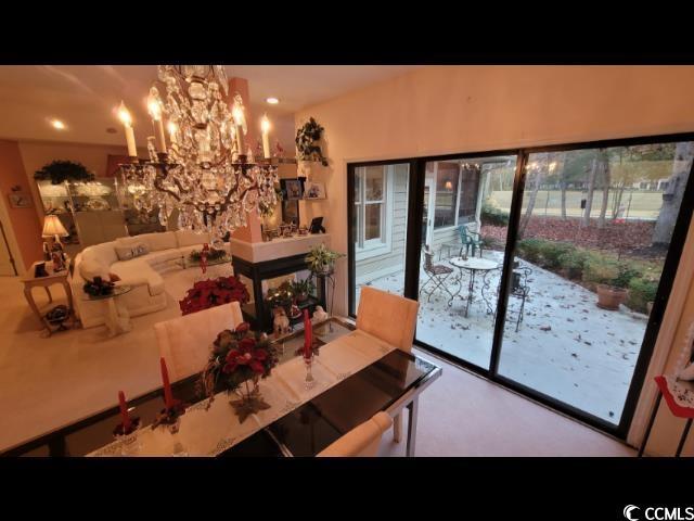 dining room featuring a notable chandelier and a healthy amount of sunlight