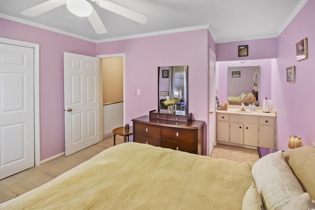 bedroom with ensuite bath, light hardwood / wood-style floors, sink, ceiling fan, and crown molding