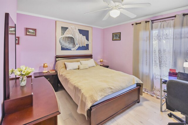 bedroom featuring light wood-type flooring, ceiling fan, and crown molding