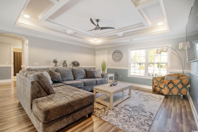 living room featuring light hardwood / wood-style floors, crown molding, and ceiling fan