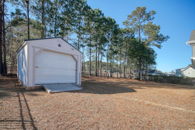 view of yard with a garage and an outdoor structure