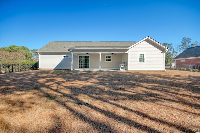 back of house featuring a patio area, central AC, and a yard