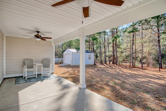 view of patio / terrace featuring a storage shed and ceiling fan