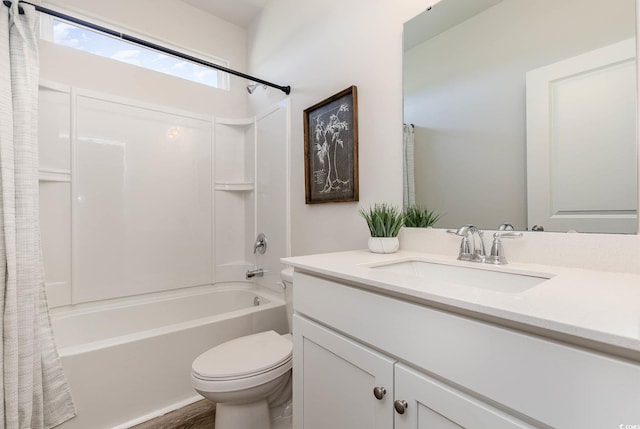 full bathroom featuring shower / bath combo, vanity, and toilet