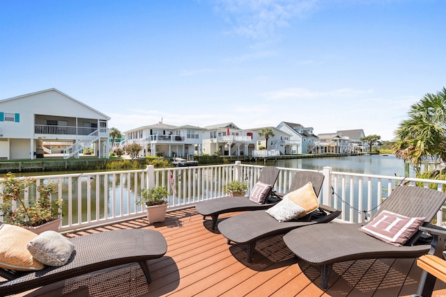 wooden deck featuring a water view