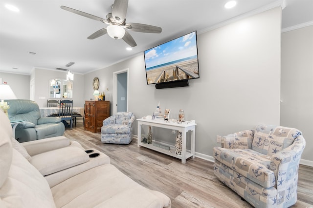 living room with ceiling fan, light hardwood / wood-style flooring, and crown molding