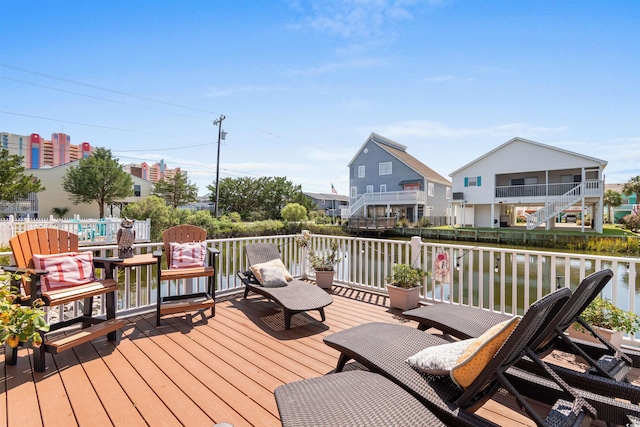 deck featuring a water view