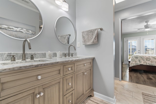 bathroom with ceiling fan, vanity, crown molding, and french doors