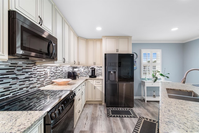 kitchen with stainless steel refrigerator with ice dispenser, sink, range, and crown molding