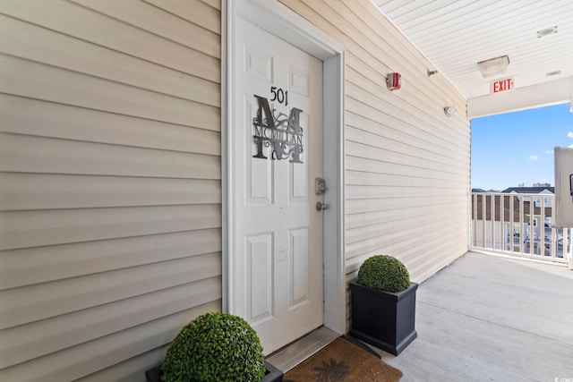 doorway to property with covered porch