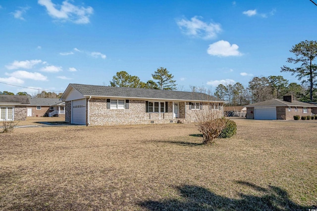 single story home featuring a garage and a front yard