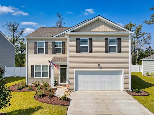 view of front of home featuring a garage and a front lawn