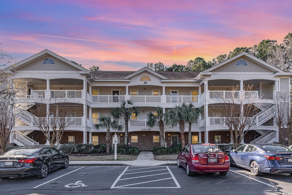 view of outdoor building at dusk