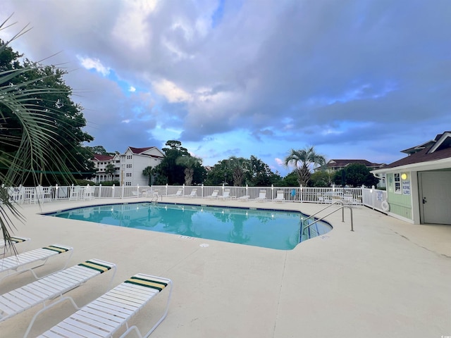 view of pool featuring a patio