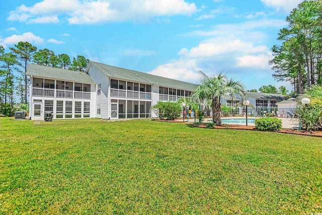 880 Fairway Dr Unit 302Bb, Longs, SC 29568 - view of building exterior with central AC unit and an outdoor pool