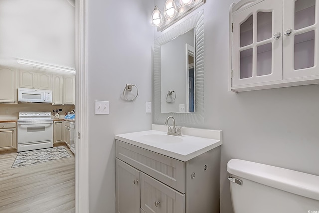 880 Fairway Dr Unit 302Bb, Longs, SC 29568 - half bath with wood finished floors, vanity, and toilet