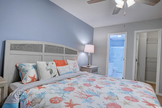 880 Fairway Dr Unit 302Bb, Longs, SC 29568 - bedroom featuring a walk in closet, lofted ceiling, ceiling fan, a textured ceiling, and ensuite bath
