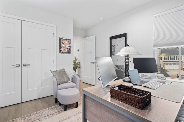 office area with light wood-type flooring