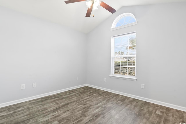 unfurnished room with dark hardwood / wood-style flooring, ceiling fan, vaulted ceiling, and a healthy amount of sunlight