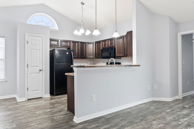 kitchen featuring hanging light fixtures, dark brown cabinetry, black appliances, kitchen peninsula, and light wood-type flooring