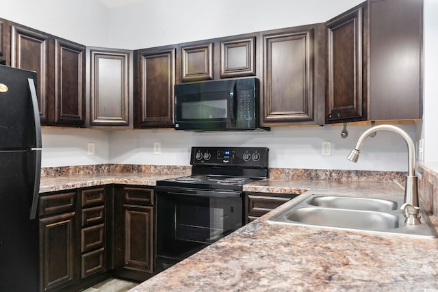 kitchen with dark brown cabinetry, sink, and black appliances