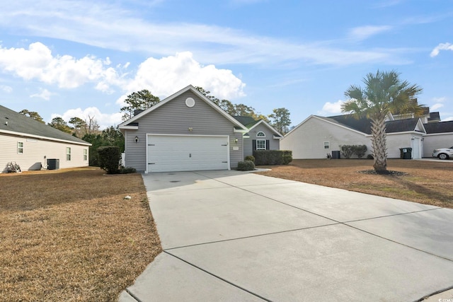 view of front of property with a garage and a front lawn