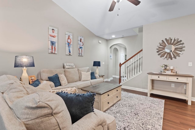 living room with hardwood / wood-style flooring, lofted ceiling, and ceiling fan