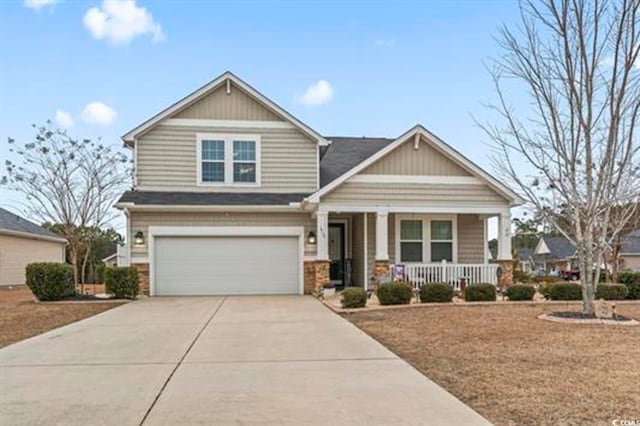 craftsman-style house featuring covered porch and a garage