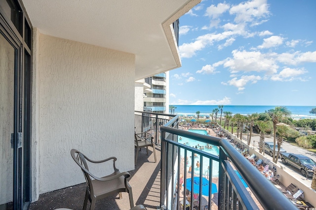 balcony featuring a water view