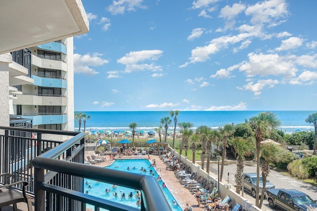 balcony featuring a water view